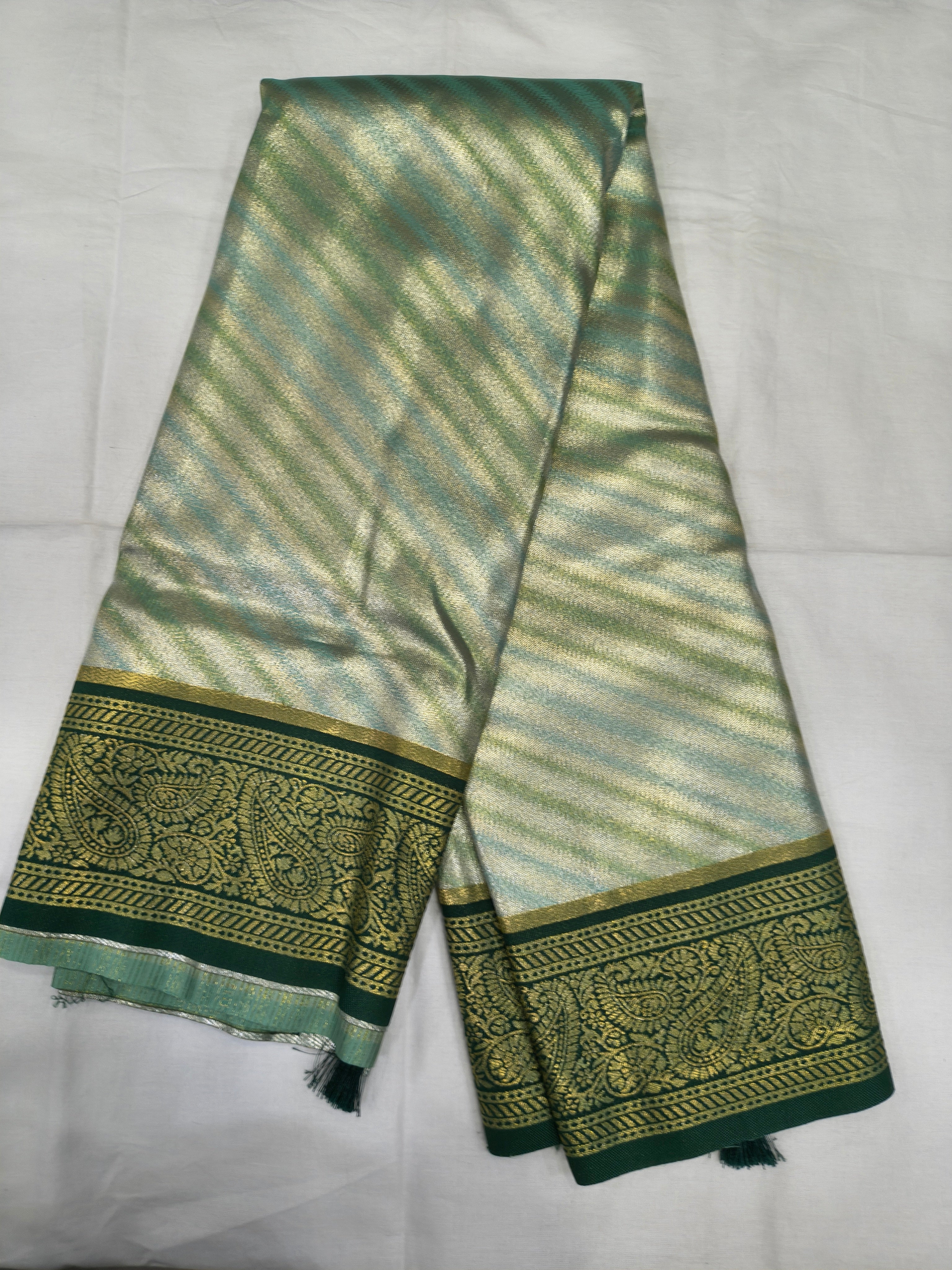 Teal and olive green Banarasi silk saree with striped body and wide gold border