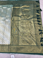 Teal and olive green Banarasi silk saree with detailed gold pallu panel and fringe