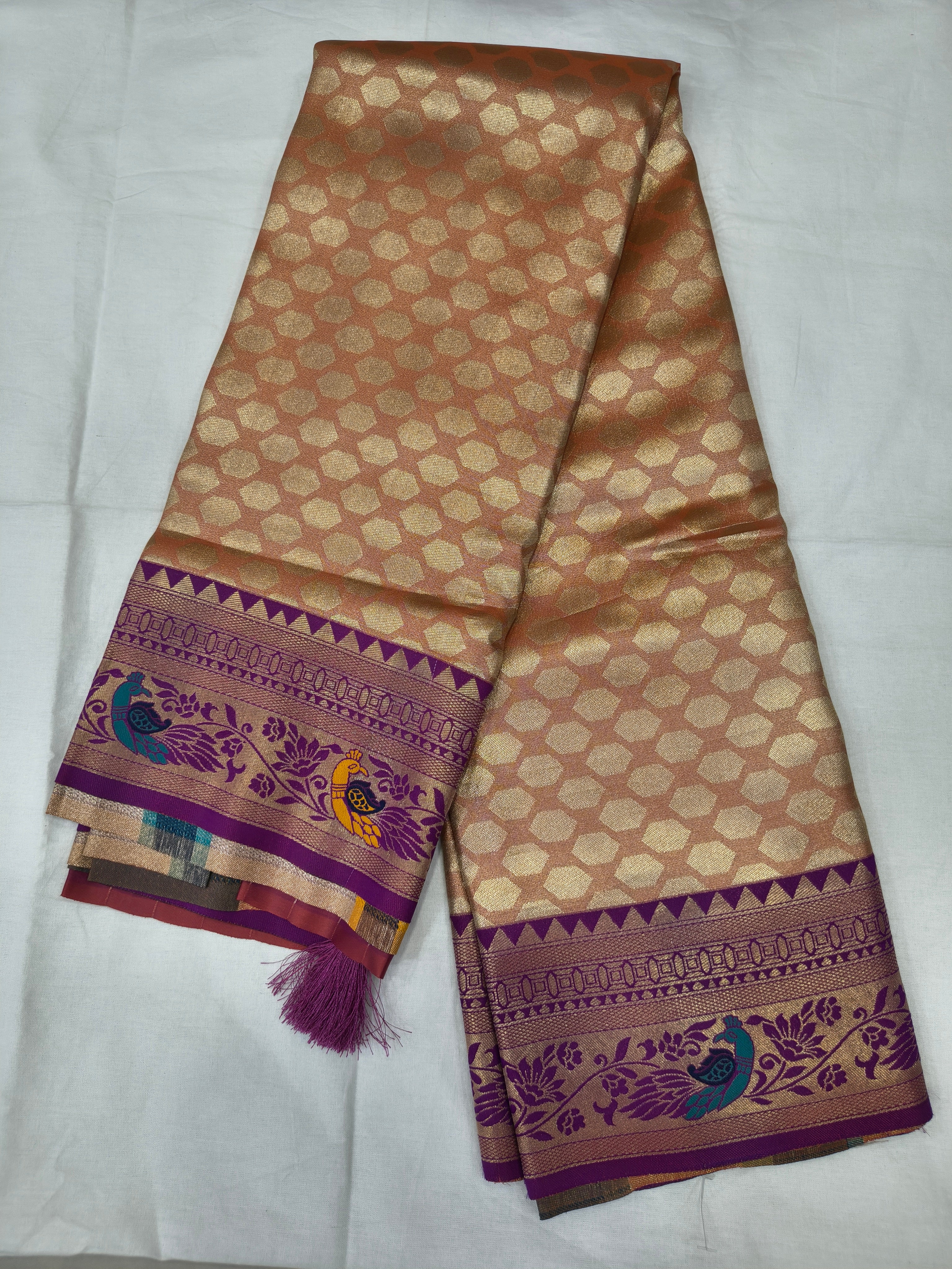 Banarasi silk saree with unstitched blouse piece, orange-brown and purple woven border