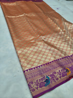 Banarasi silk saree pleat with orange-brown geometric pattern and purple zari border
