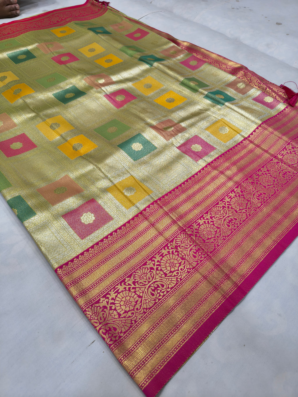 Silk saree with multicolor geometric checks, magenta-red border and ornate stripe