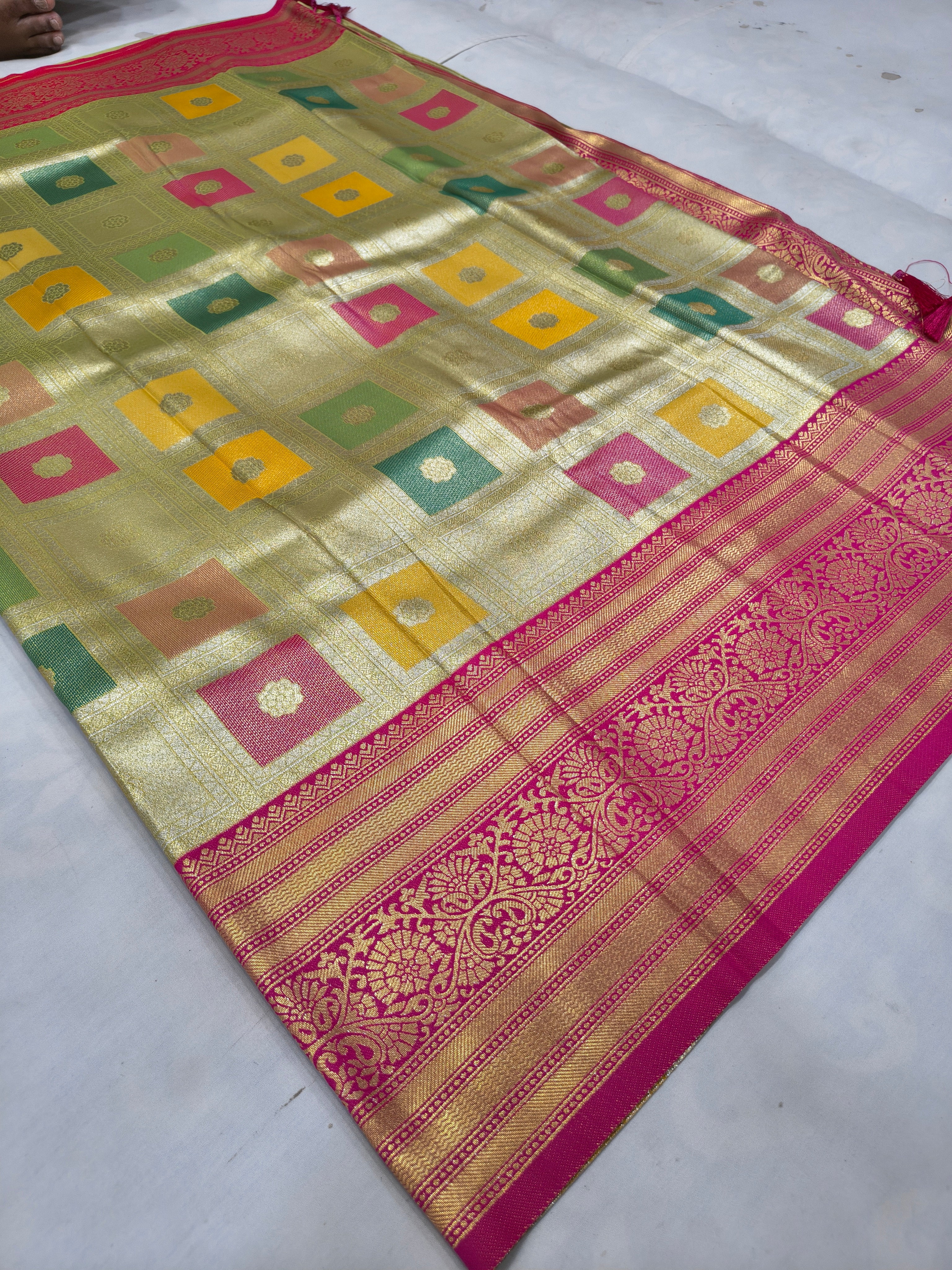 Silk saree with multicolor geometric checks, magenta-red border and ornate stripe