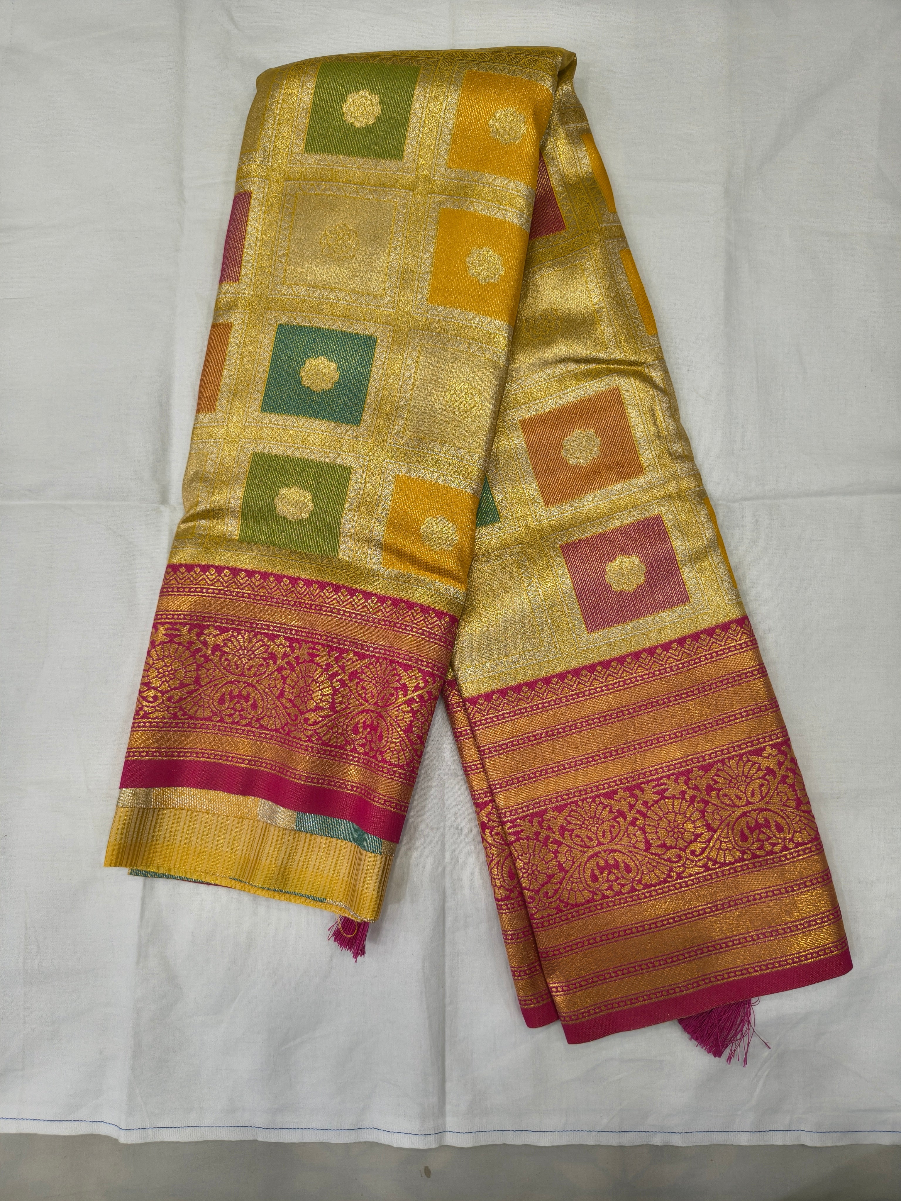 Banarasi silk saree in yellow with pink geometric motifs and woven gold border