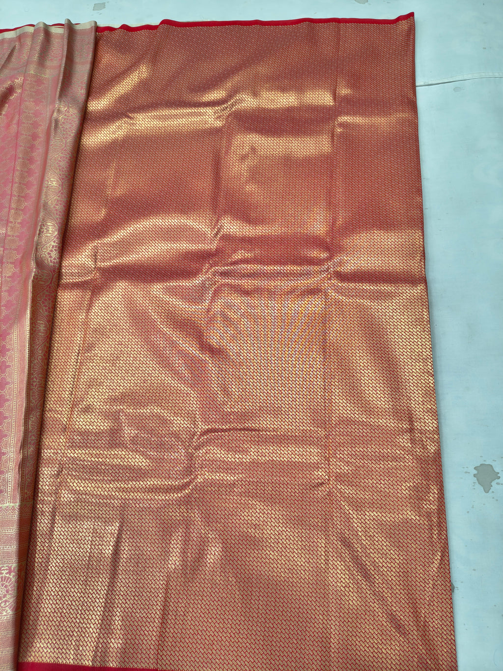 Gold and red Banarasi silk saree pallu with gold sheen and red border edge