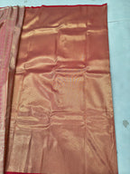 Gold and red Banarasi silk saree pallu with gold sheen and red border edge
