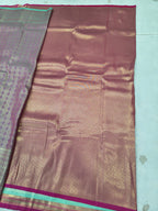 Pastel silk saree with multicolor woven motifs and pink-gold border