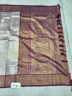 Silver and purple Banarasi silk saree border with paisley motifs and tassels