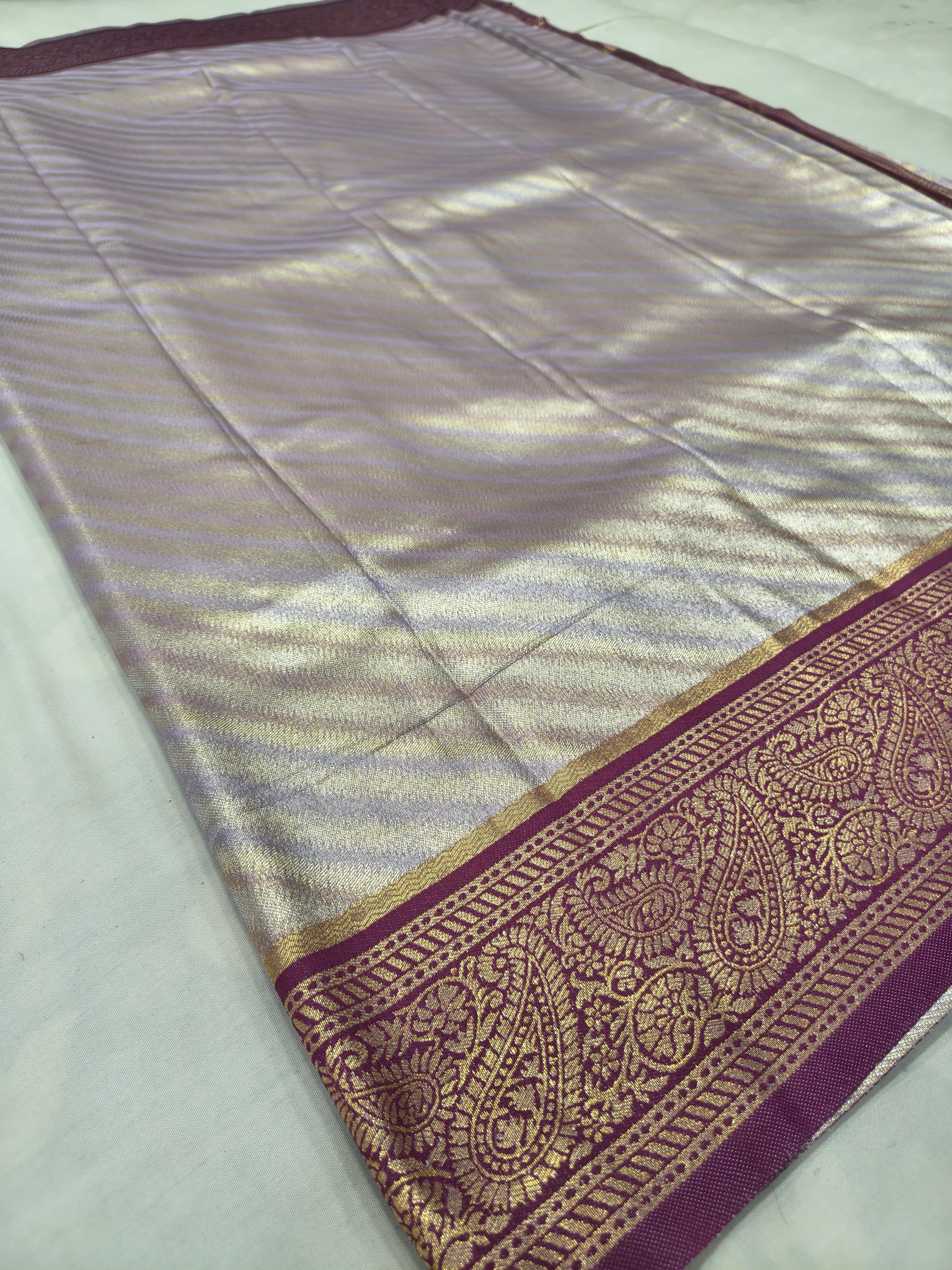 Silver and purple Banarasi silk saree pallu with maroon-gold border detailing