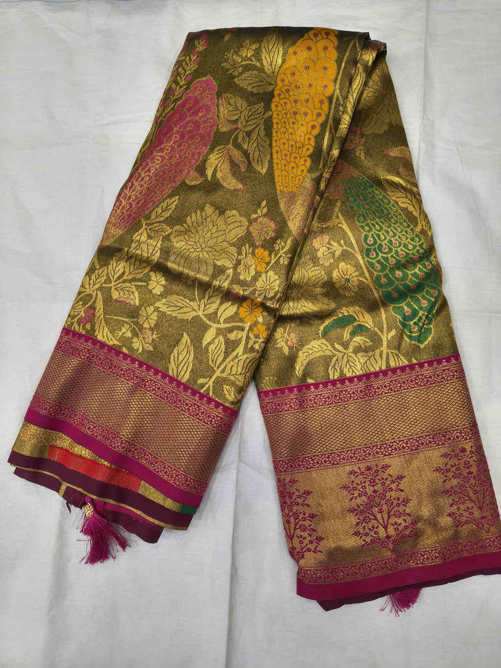 Olive and pink Banarasi silk saree with gold-tone botanical motifs and magenta border