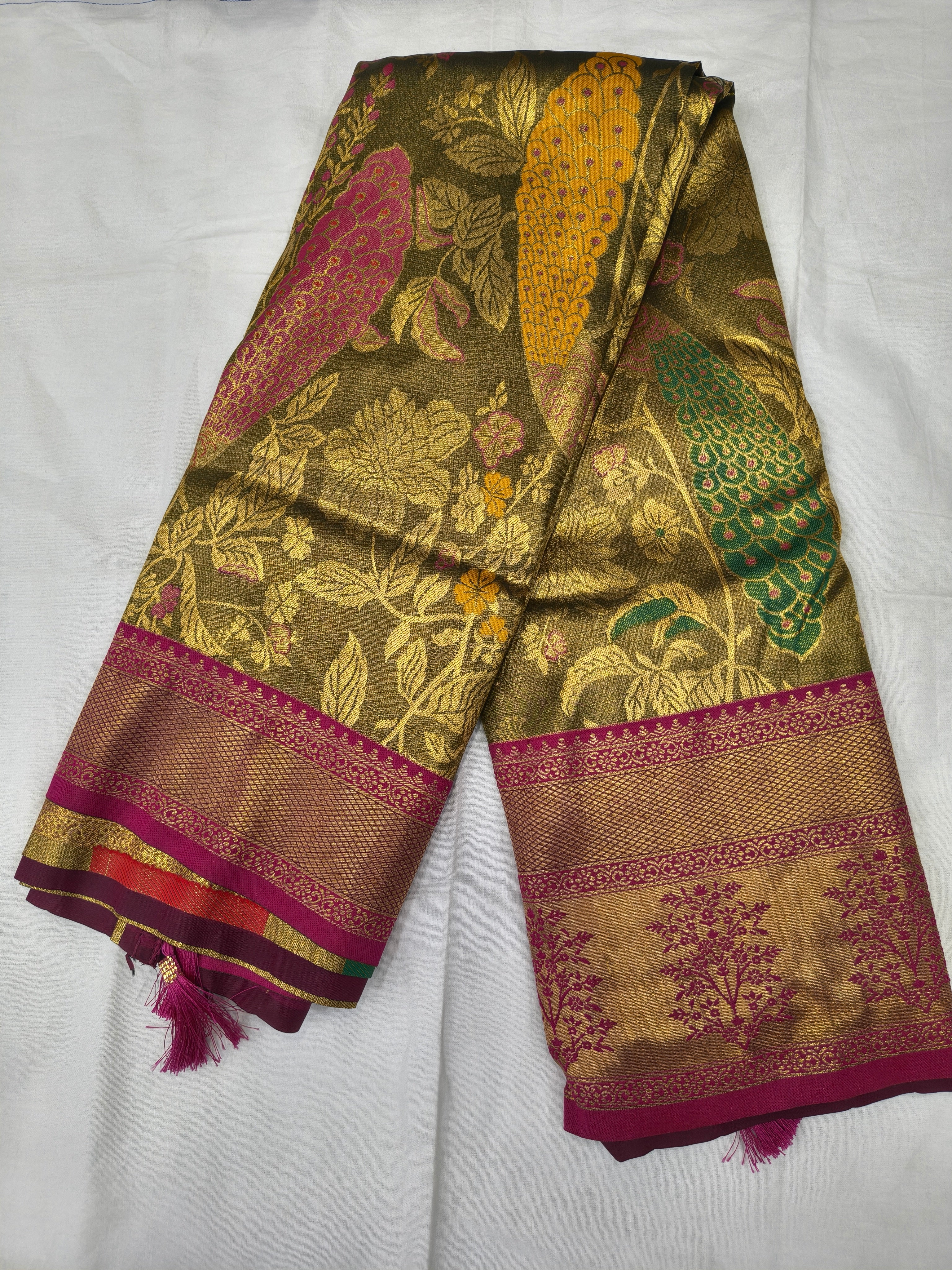 Olive and pink Banarasi silk saree with gold-tone botanical motifs and magenta border