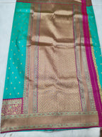 Banarasi pallu panel with maroon and gold motifs on turquoise saree