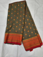 Grey-green Banarasi-style silk saree with orange border and small golden motifs