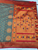 Banarasi-style saree pallu with orange center panel, multicolor embroidery and patterned border