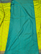 Teal section with vertical stripes and woven trim on neon yellow saree