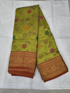 Light green Kanchipuram silk saree with red border and floral vine motifs