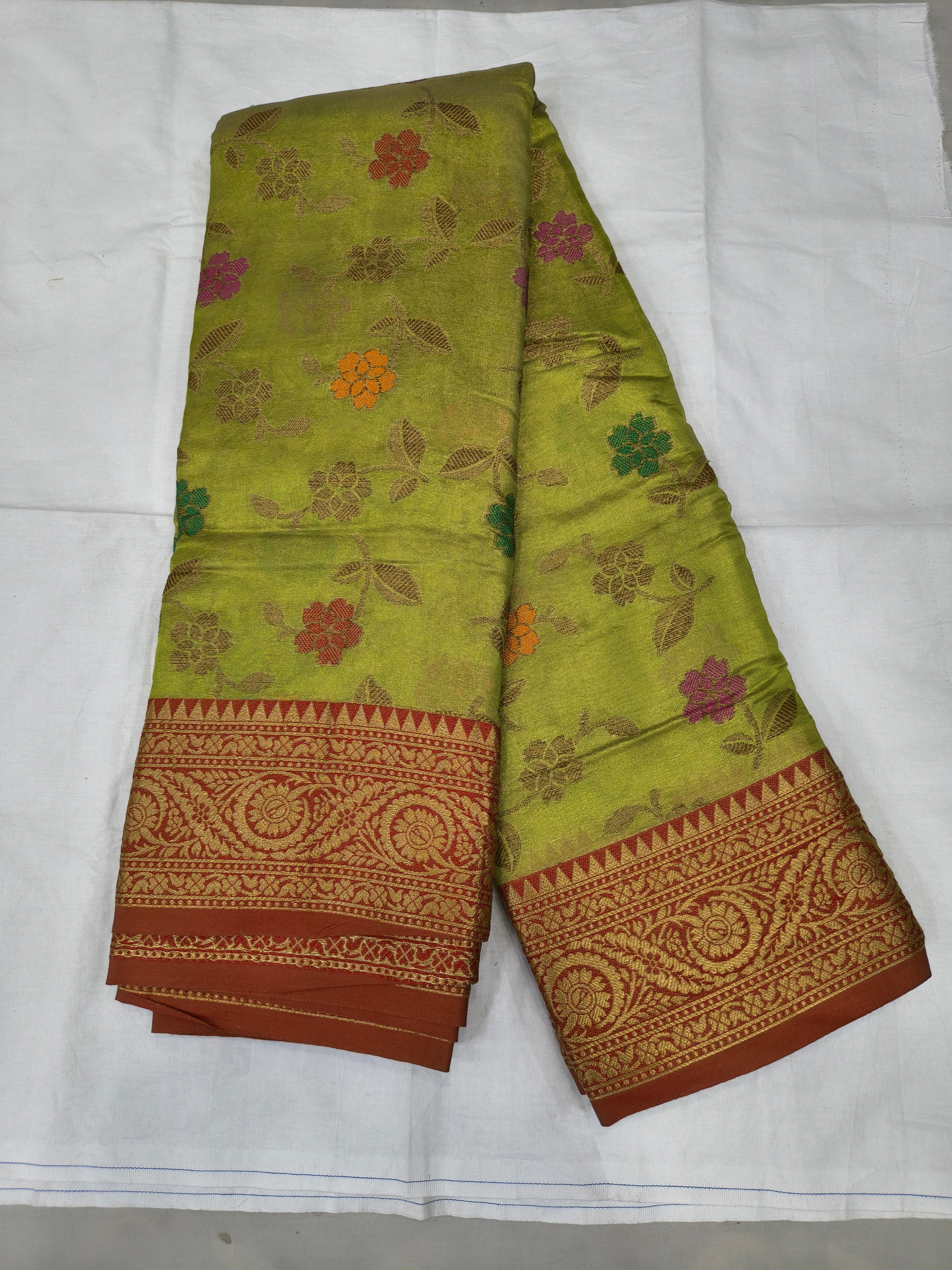 Light green Kanchipuram silk saree with red border and floral vine motifs