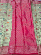 Light green and magenta silk saree with floral prints and red zari border
