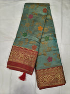 Teal sky-blue silk saree with red-gold Kanchipuram-style border and floral motifs