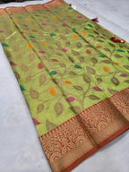 Light green saree with leaf motifs and ornate maroon border on one edge