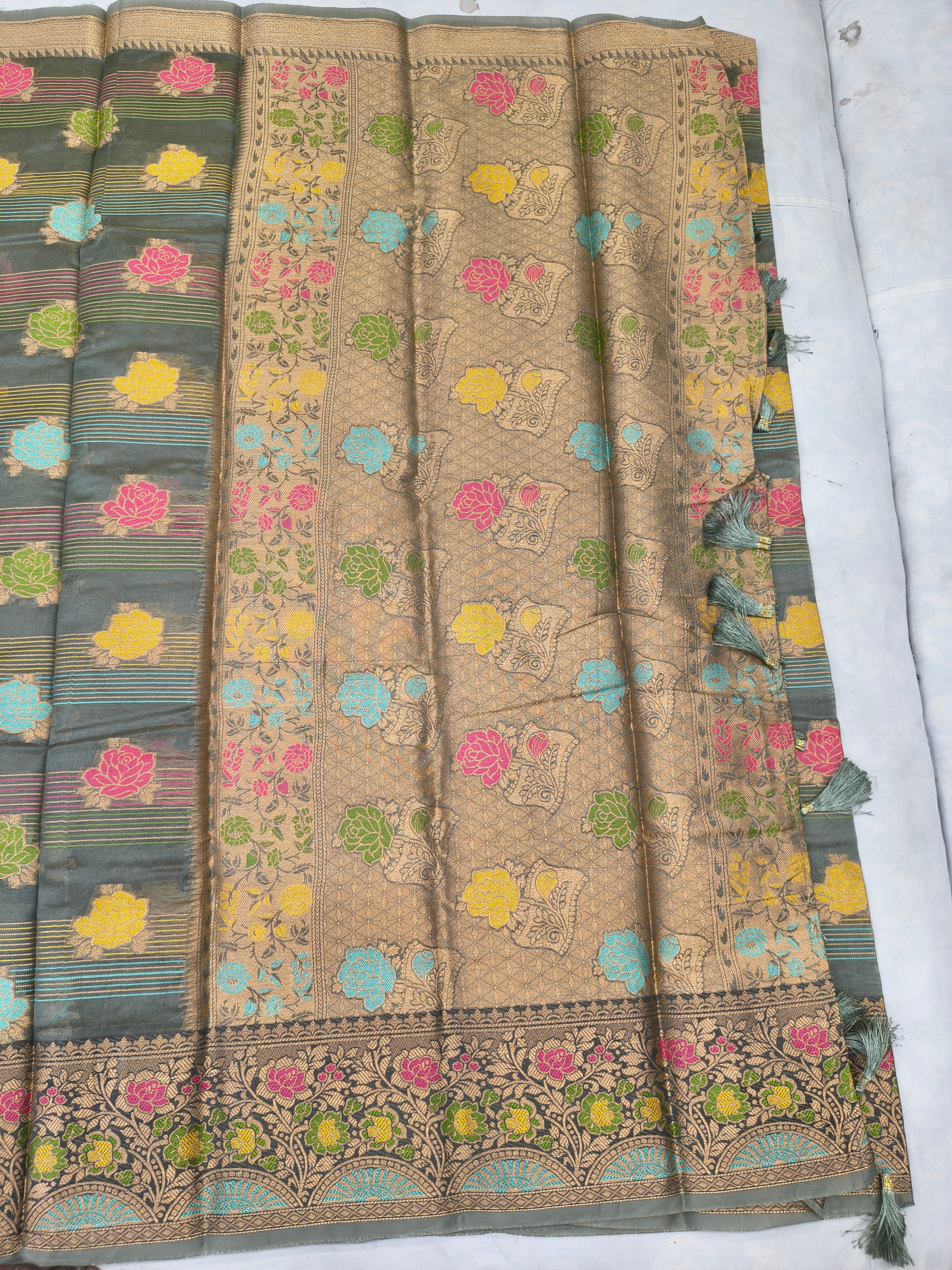 Beige-gold silk saree with small woven dots and colorful floral border