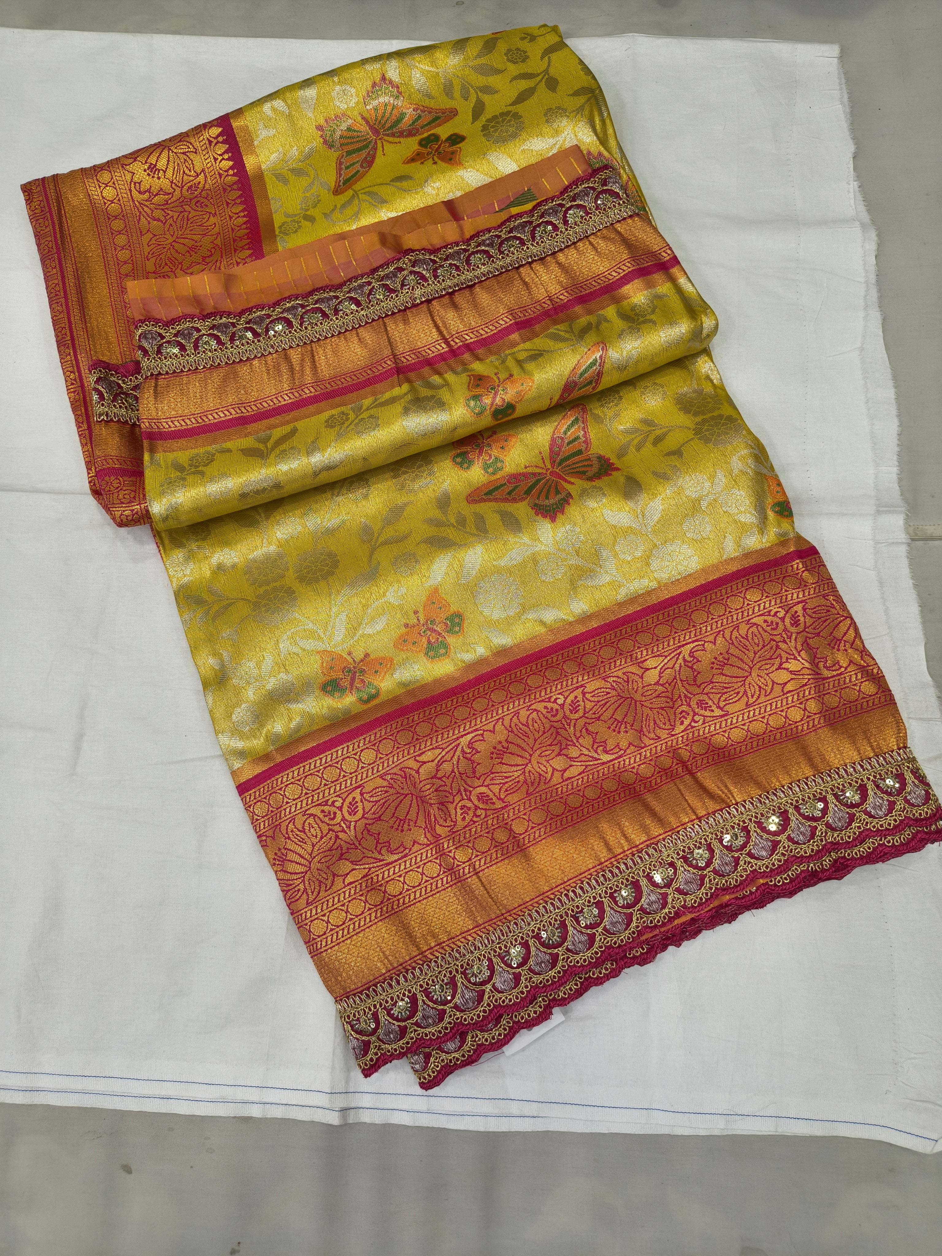Yellow and pink Banarasi silk saree with woven motifs and contrast border