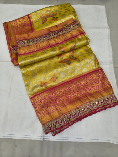 Yellow and pink Banarasi silk saree with woven motifs and contrast border