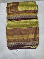 Folded Banarasi silk saree swatch, olive green with maroon-gold border