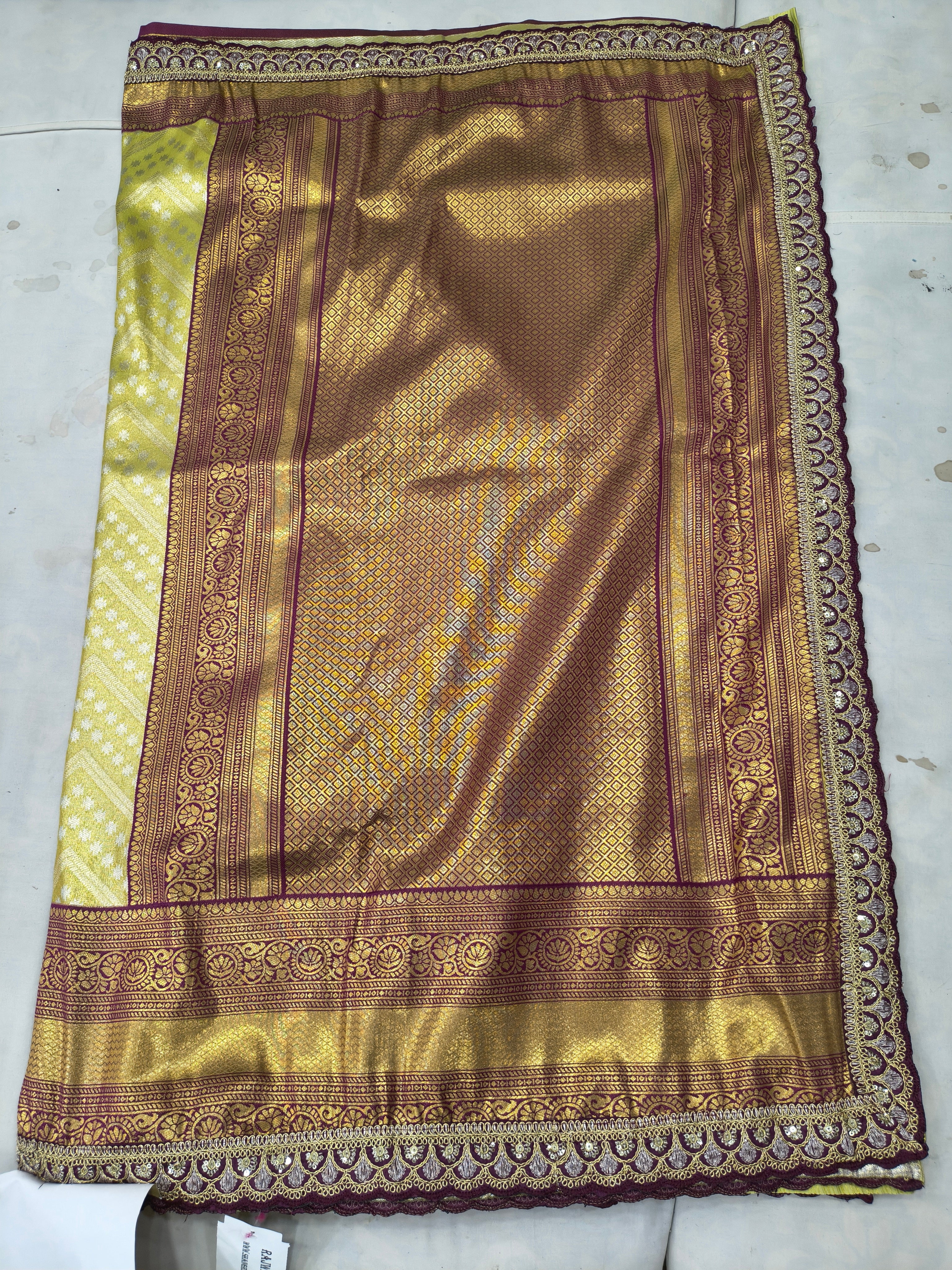 Banarasi silk saree fabric close-up, olive green with maroon border and motifs