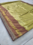 Lying Banarasi silk saree with olive green body, maroon-gold pallu border