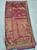 Maroon-pink Banarasi silk saree panel with teal border and ornate gold trim