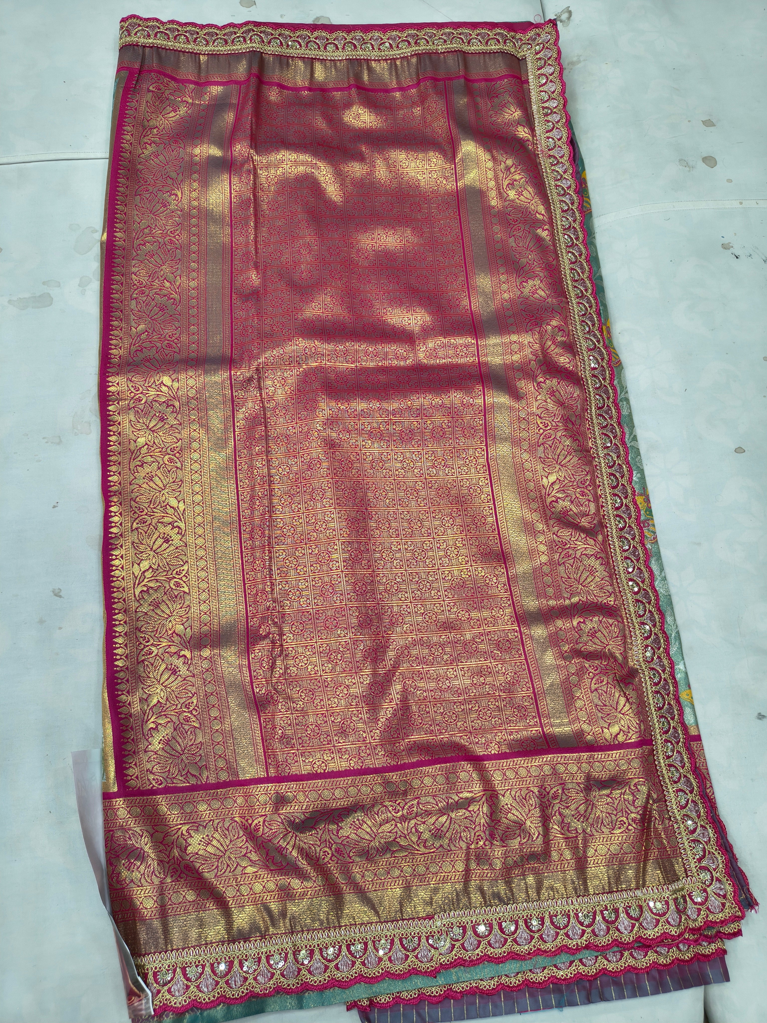 Maroon-pink Banarasi silk saree panel with teal border and ornate gold trim