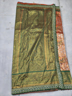 Olive green pallu panel on peach Banarasi silk saree with detailed border