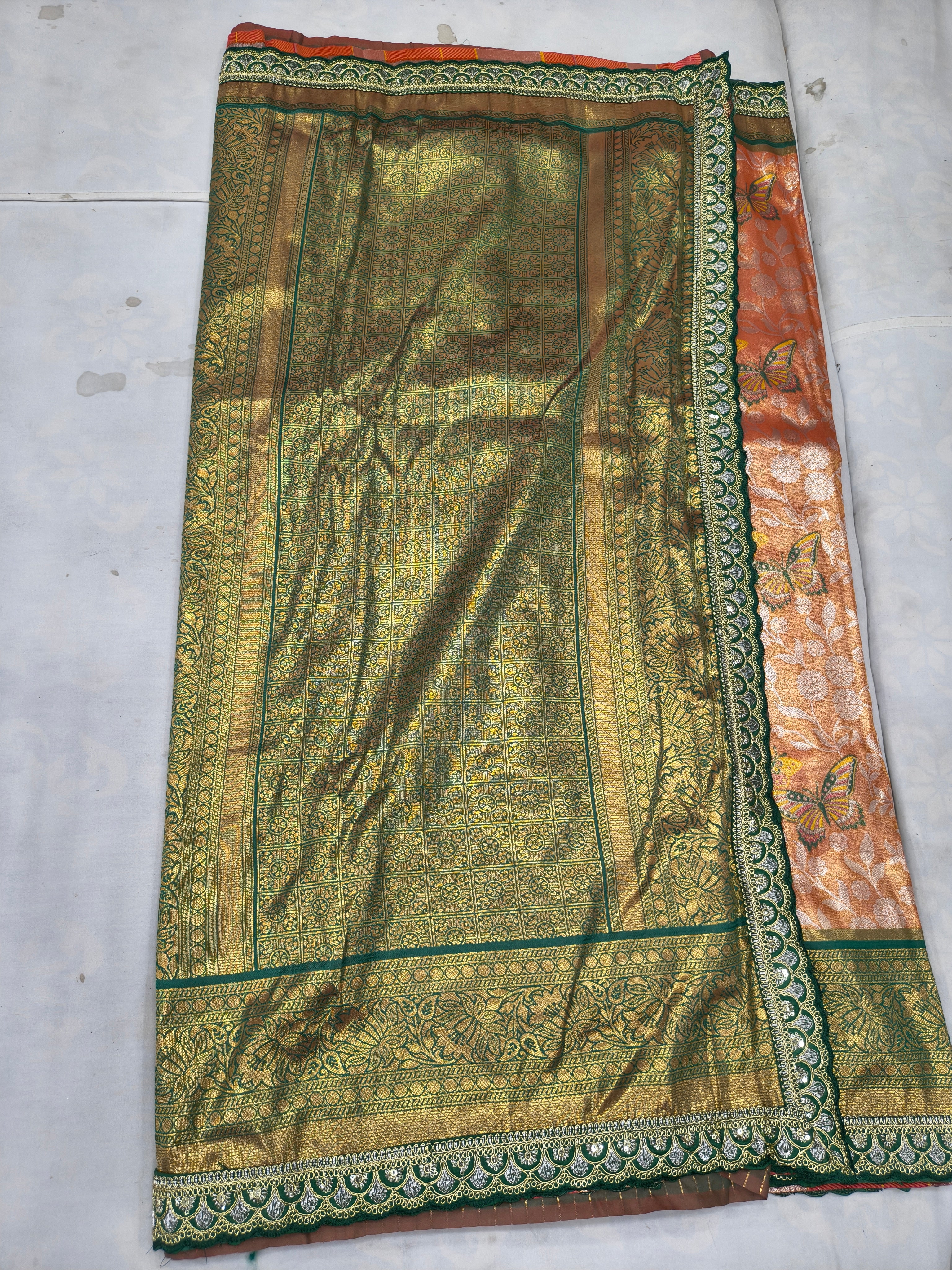 Olive green pallu panel on peach Banarasi silk saree with detailed border