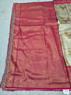 Unstitched pink Banarasi silk blouse fabric with decorative gold edge and patterned design
