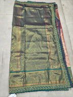 Teal-green Banarasi silk saree section with gold patterned border