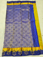 Royal blue saree with yellow border and gold floral swirl motifs