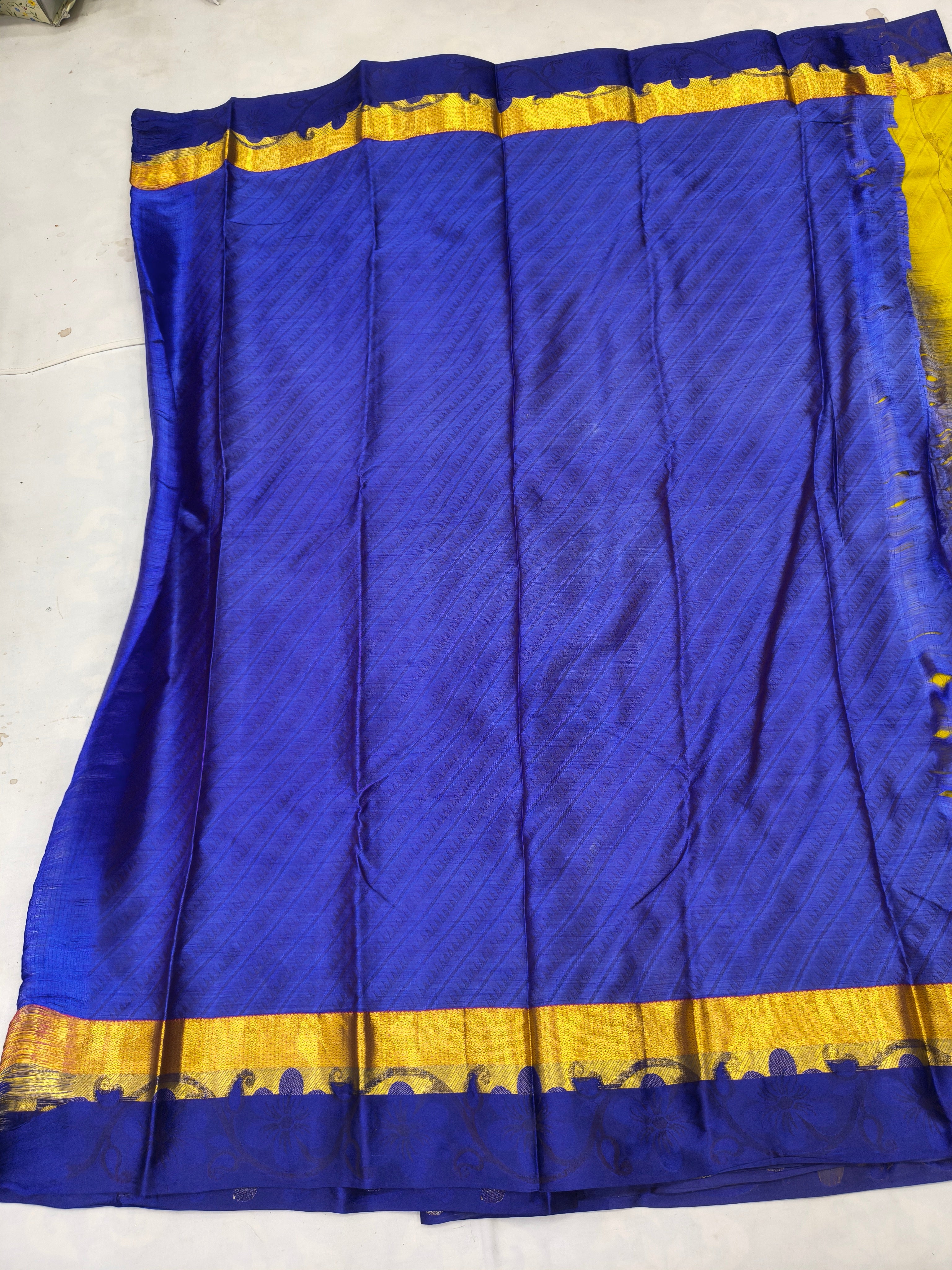 Royal blue Kanchipuram silk saree with wide yellow-gold border panel