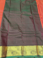 Green and dark maroon patterned saree section with gold border at hem