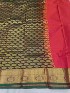 Dark green and gold patterned saree fabric with red panel and gold border