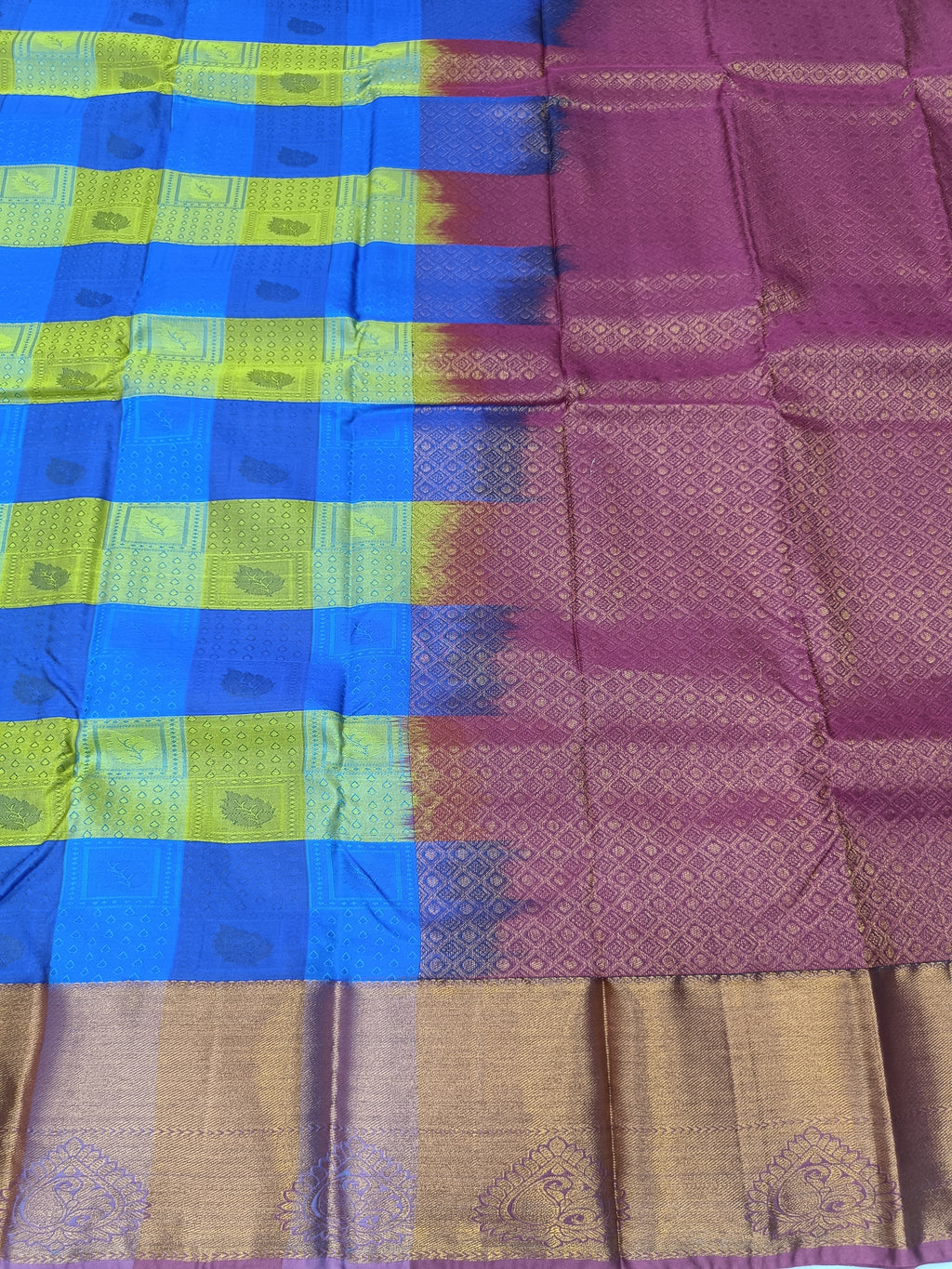 Kanchipuram silk saree close-up with blue and purple checks and tan zari border