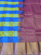 Kanchipuram silk saree close-up with blue and purple checks and tan zari border
