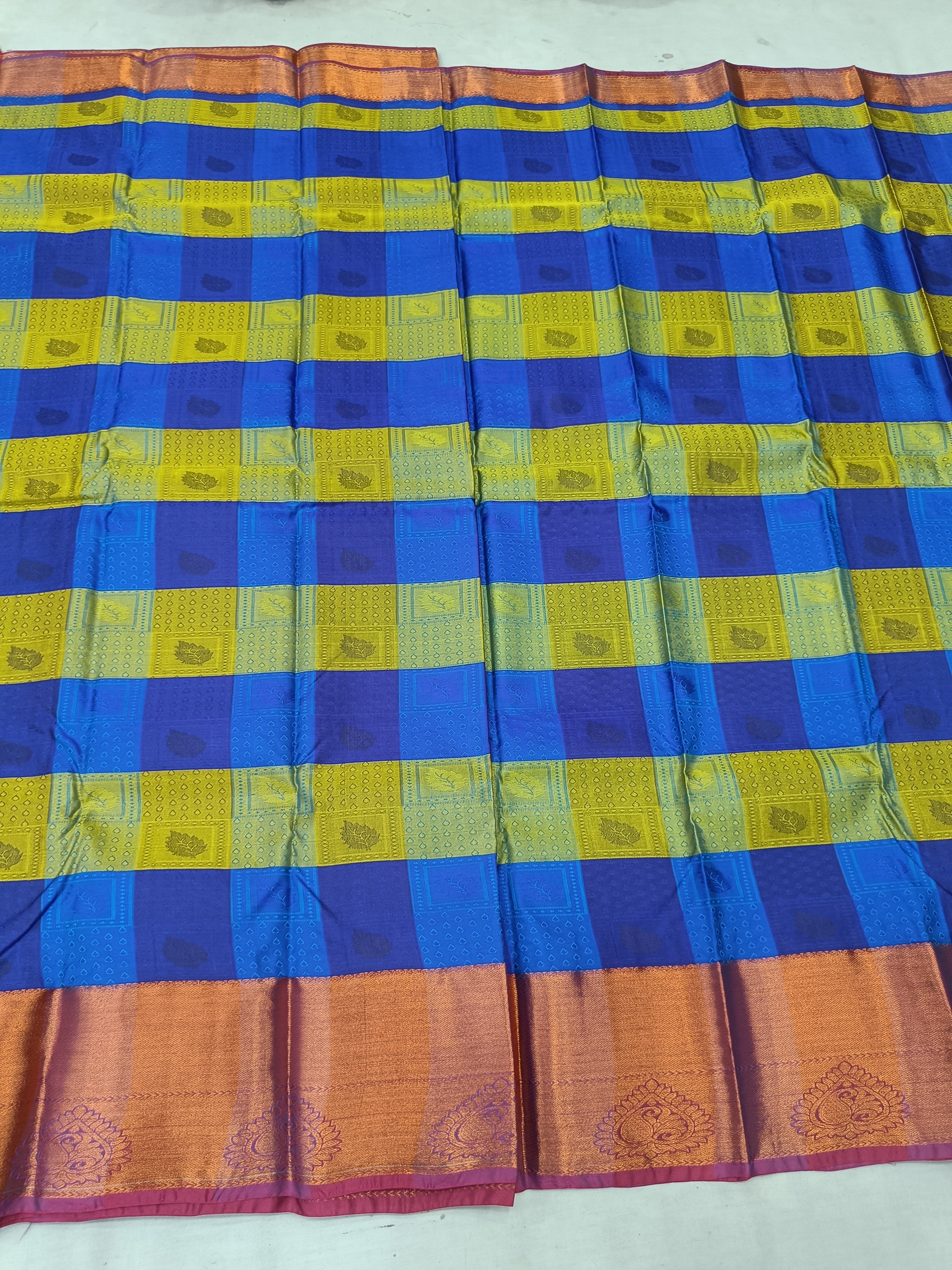 Kanchipuram silk saree border with blue and yellow horizontal stripes and peach panel