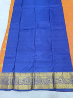 Blue silk saree with mustard border and ornate zari-patterned hem