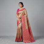 Woman wearing multicolor silk saree with teal-gold patterned body and magenta border