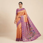 Women’s Banarasi silk saree in orange-brown with purple border and pallu peacock print