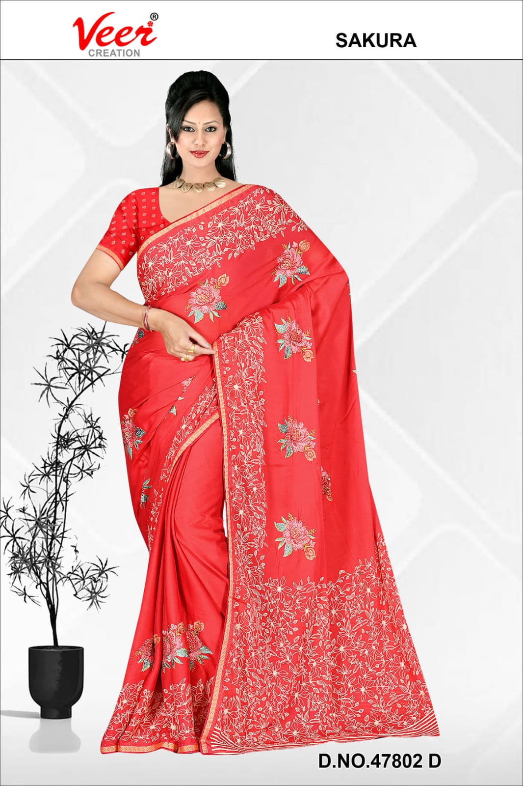 Red saree with pink floral embroidery and leaf border, draped with matching blouse