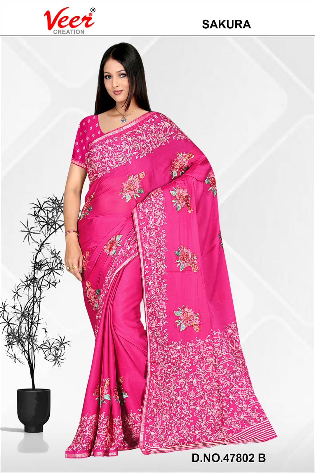 Pink saree with dense floral embroidery and leaf border, draped with matching blouse